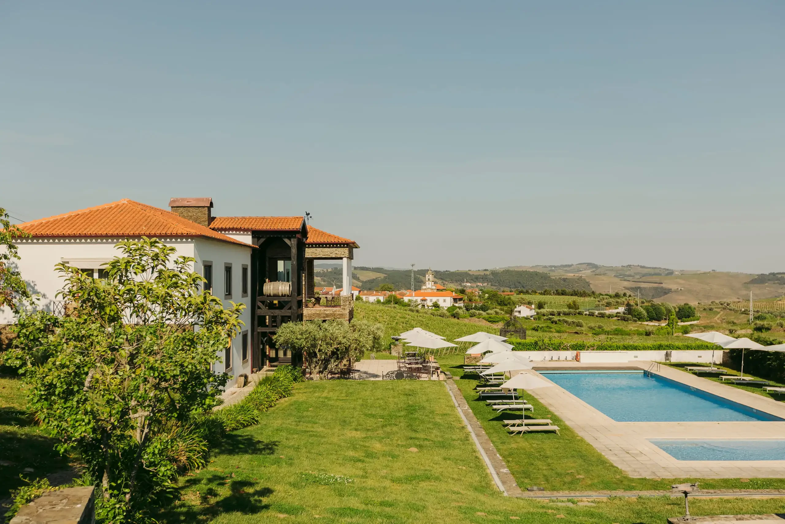 Outdoor swimming pool with panoramic views at Douro The Manor House Celeirós